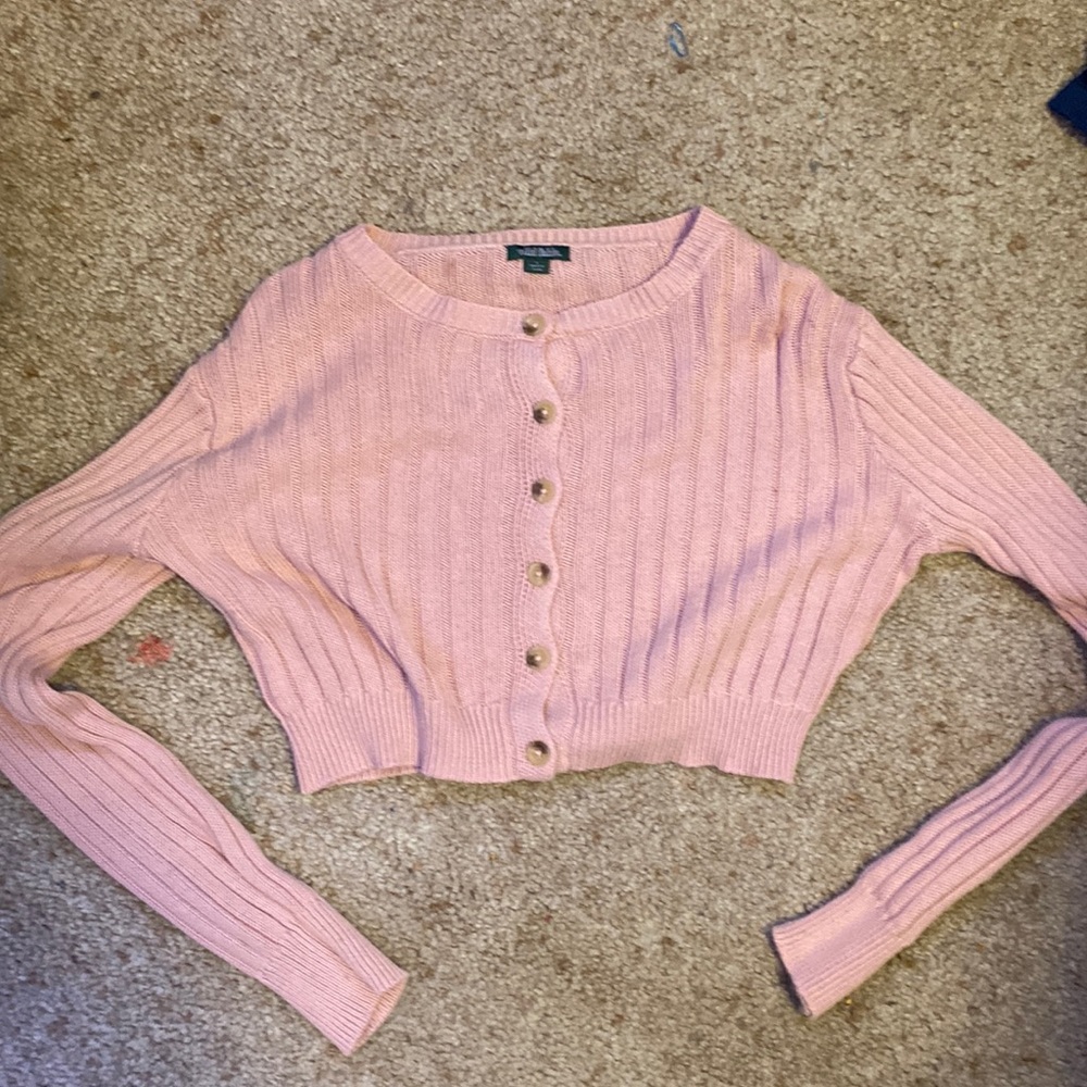 Pink sweater. Only been warn once, washed twice, the size is a large